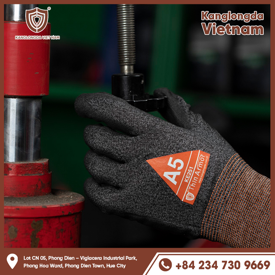 A worker wearing KE242 gloves while operating mechanical equipment