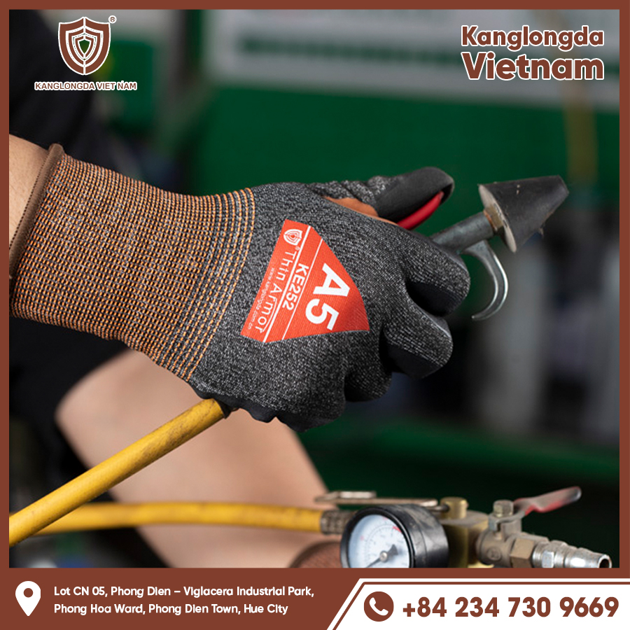Image of KE252 holding a heavy mechanical tool with his hands outstretched in gloves Image of KE252 holding a heavy mechanical tool with his hands outstretched in gloves